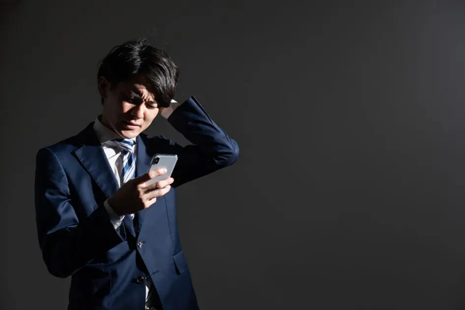 Asian young businessman on a dark background